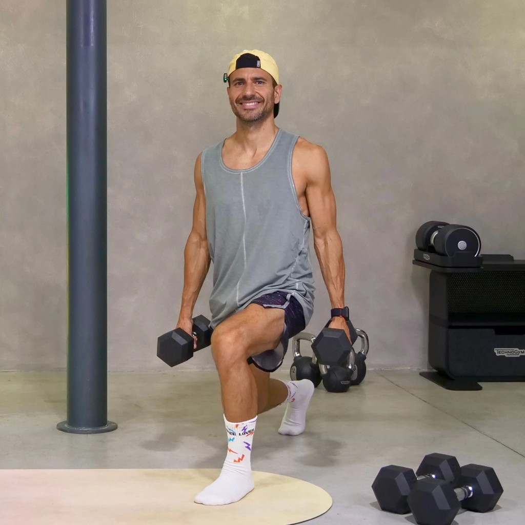 Allenamento PHA Body Reset — affondo con manubri